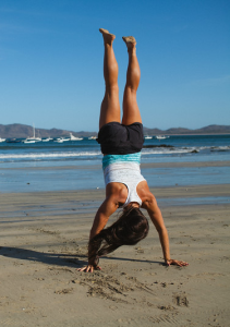 A yoga beach handstand.